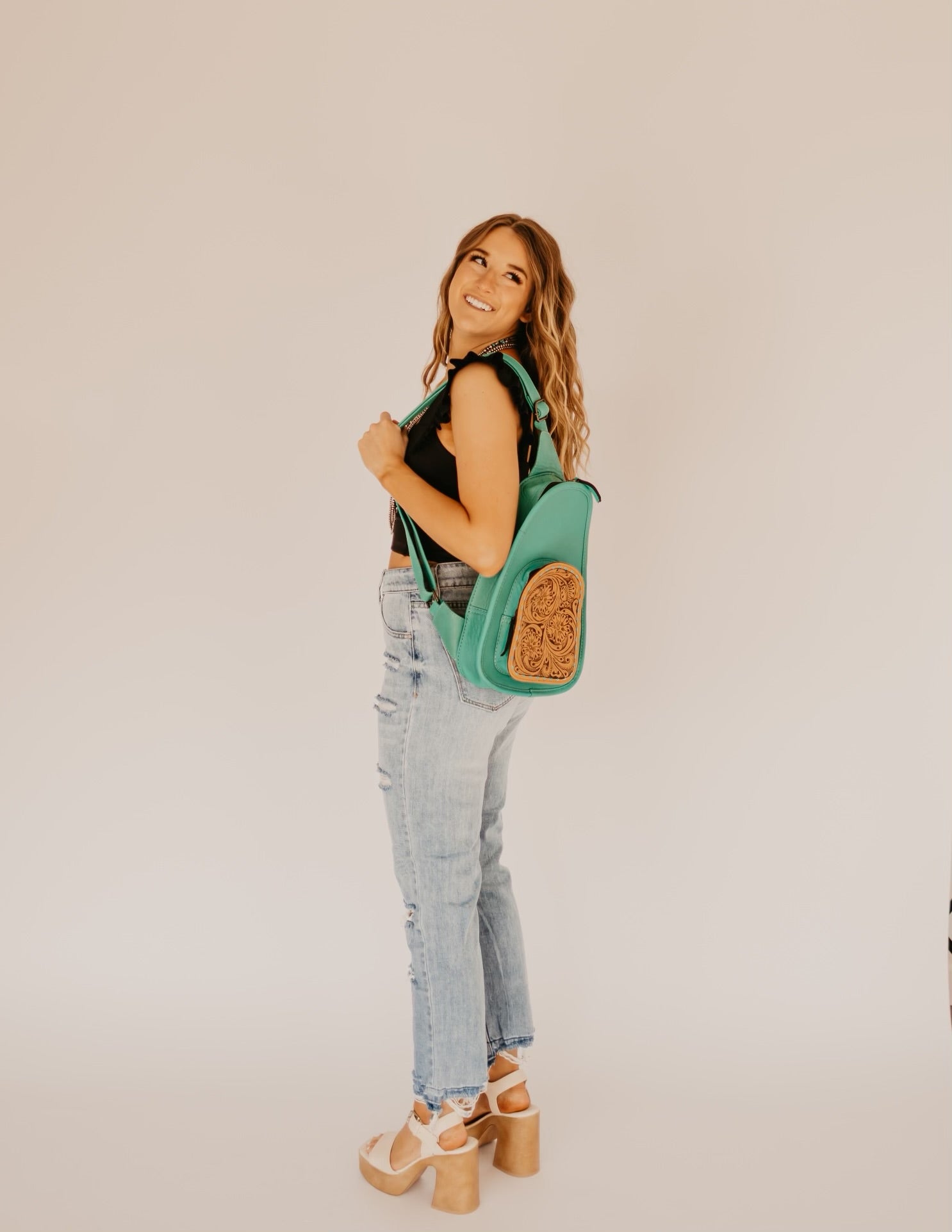 The Melleville Turquoise Sling Bag